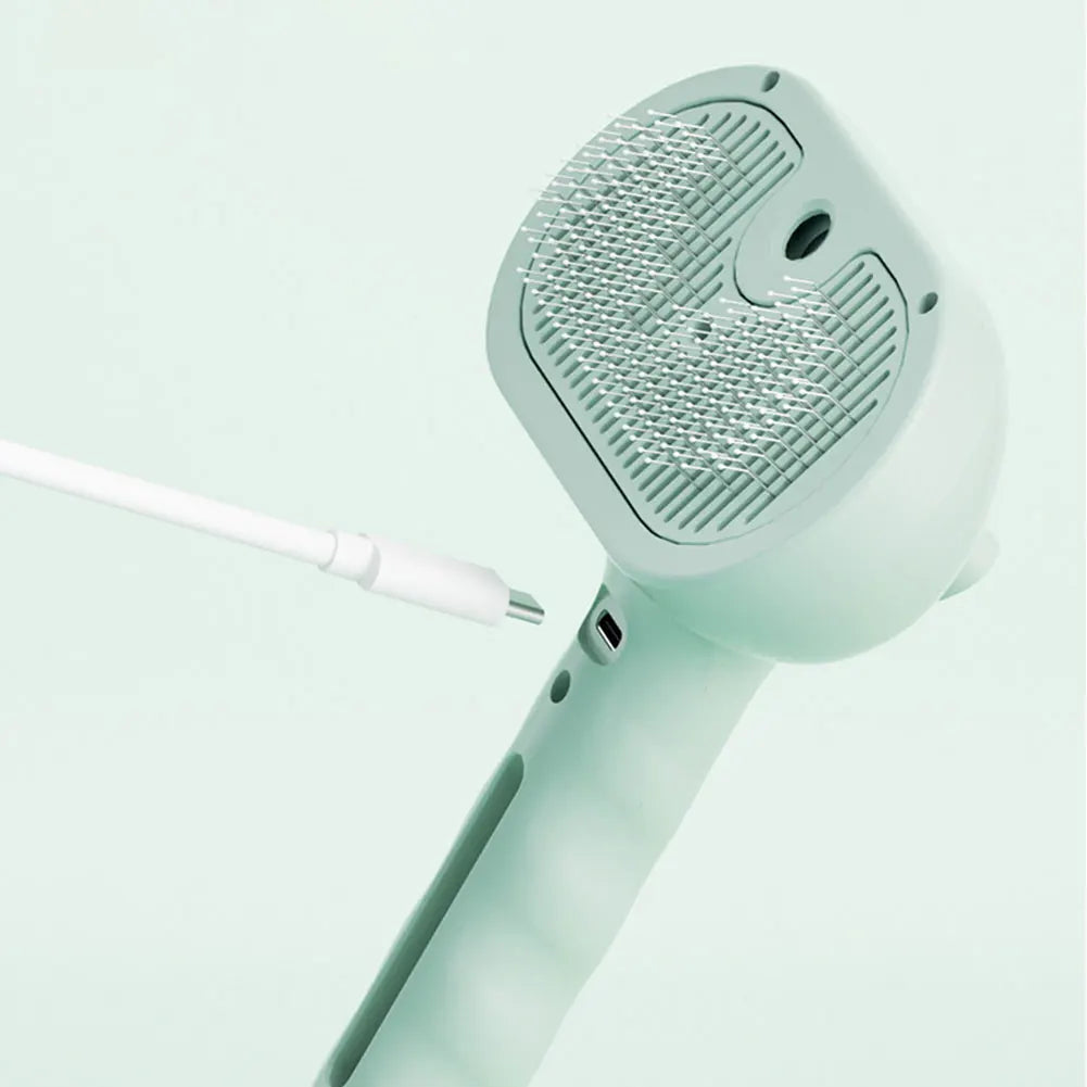 Pet steam brush for gentle grooming, removing pet hair and dirt effectively